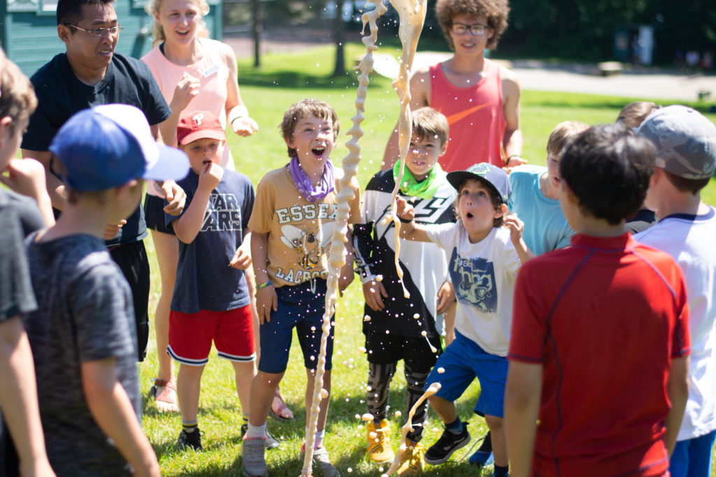 Kids looking excited at a science experiment